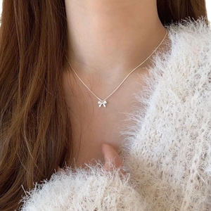 Elegant 925 sterling silver bow necklace for women featuring a minimalist Korean ribbon pendant