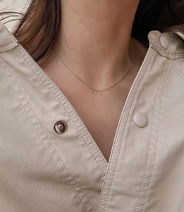Elegant gold 925 silver necklace with three round faceted zircons on delicate chain