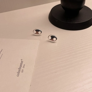 Polished 925 sterling silver pig nose stud earrings displayed at a 45-degree angle