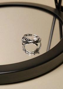Mirror reflection showing details of an adjustable 925 silver bow ring for women