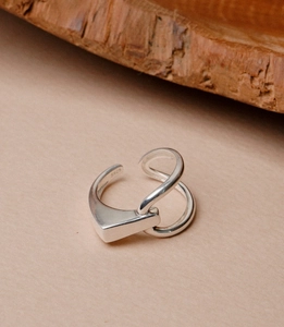 Macro shot of S925 sterling silver stamp on minimalist geometric asymmetrical ring