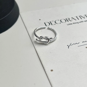 Minimalist sterling silver twisted knot open ring with adjustable braided band design