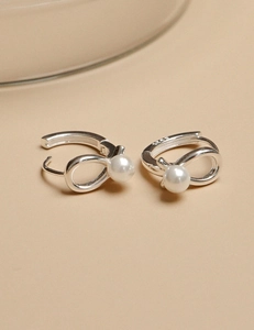 Macro shot of 925 sterling silver pearl earrings showing S925 hallmark and clasp detail