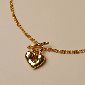 Collier maille gourmette en argent 925 doré avec pendentif cœur et fermoir à bascule