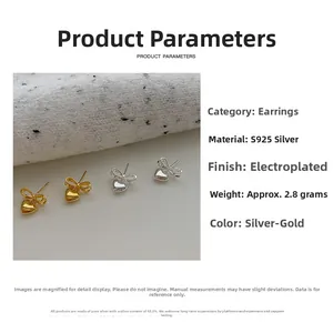 Détail des boucles d'oreilles nœud et cœur en argent S925 finitions or et argenté