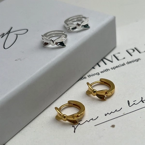 Minimalist S925 silver butterfly bow earrings in polished silver and gold finishes