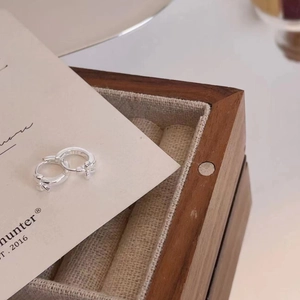 925 Sterling silver hoop earrings with delicate cross pendant on display card