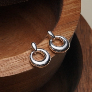 S925 sterling silver geometric donut earrings with a polished round hoop design