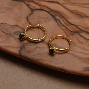 925 silver gold-plated mini huggie earrings with black round gemstone on wood base
