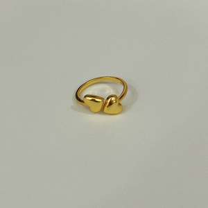 Detail view of the S925 hallmark on a minimalist gold double heart open ring
