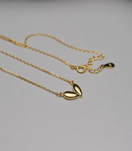 Detailed macro view of S925 sterling silver heart pendant with lobster clasp and chain