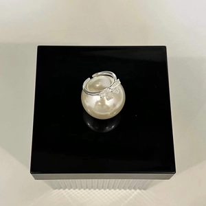 Adjustable 925 sterling silver bow ring with sparkling pavé cubic zirconia accents