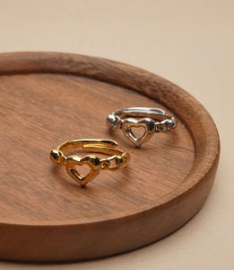 Detail of S925 sterling silver stamp on minimalist adjustable heart ring set