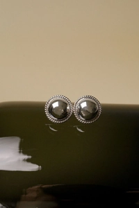 Detailed view of S925 sterling silver ball stud earrings with retro rope-style borders