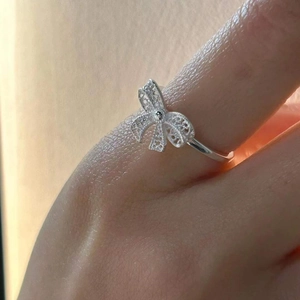 Minimalist 925 sterling silver hollow bow ring with delicate filigree details for women