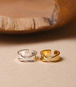 Close-up of S925 hallmark on the inner band of twisted silver and gold rings