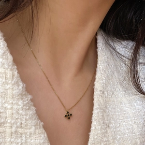 925 silver gold-plated clover necklace with black zircon stones worn on model