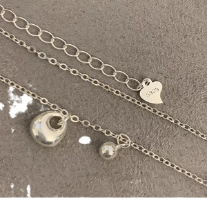 S925 sterling silver layered necklace with heart, water drop, and bead charms on velvet