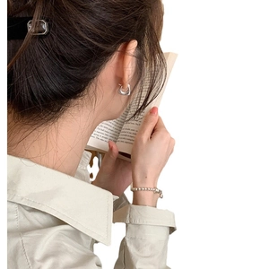 Minimalist S925 silver geometric hoop earrings and bead bracelet on female model