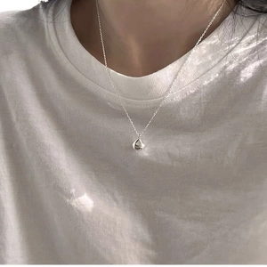 Minimalist sterling silver teardrop necklace for women with polished reflective finish