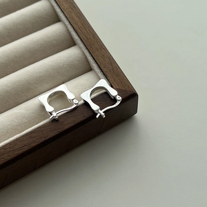 Detailed close-up of S925 sterling silver square earrings showing the hallmark stamp