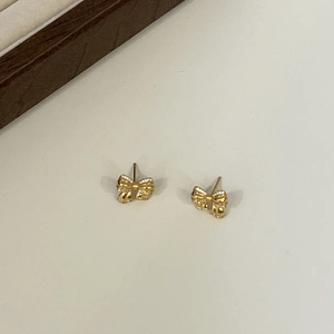 Elegant 925 sterling silver golden bow stud earrings with sparkling zircon stones