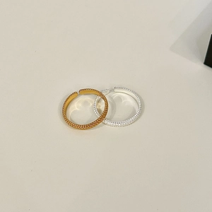 Detail of twisted texture on adjustable S925 silver rings in gold and silver finish
