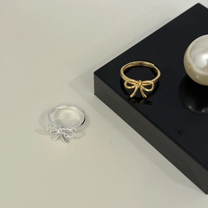 Minimalist 925 sterling silver bow rings in gold and silver finish with adjustable band
