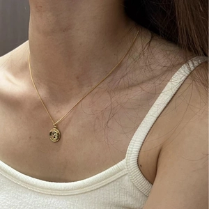 French vintage gold coin necklace with embossed queen portrait on minimalist chain