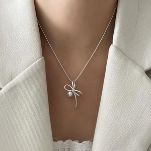 Elegant 925 sterling silver bow necklace with a round white pearl for women