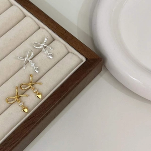 Elegant S925 sterling silver bowknot earrings with zircon heart pendants in gold and silver