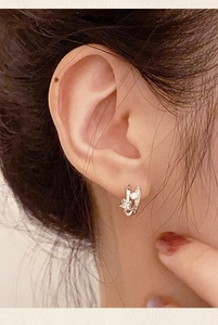 Detail view of 925 silver sterling shooting star earring hoop with cubic zirconia stones