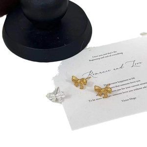 Exquisite 925 sterling silver hollow bow earrings in gold and silver finish