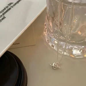 Elegant S925 sterling silver heart planet necklace on aesthetic lifestyle background