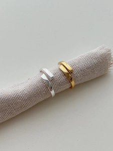 Minimalist S925 sterling silver open rings in gold and silver finish on linen texture