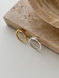 Detail of minimalist S925 sterling silver and gold plated rings with inner hallmarks