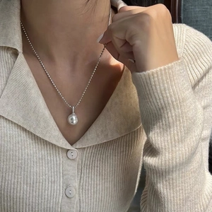 Elegant 925 sterling silver ball chain necklace with a large round white crystal pearl