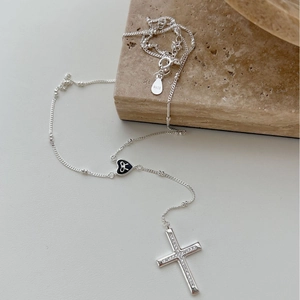 S925 silver cross necklace with diamond pendant and black enamel heart on marble stone