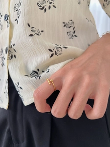 Minimalist adjustable gold ring with small beads shown on model for a trendy daily look
