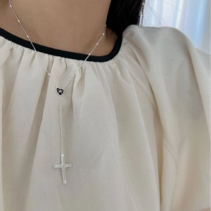 925 Sterling silver Y-shaped cross necklace with black heart and bow pendant on model