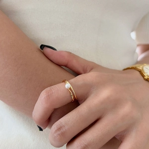 Minimalist 925 sterling silver pearl cross ring with a twisted gold finish for women