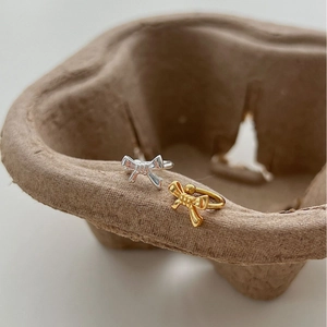 Elegant 925 sterling silver bow stud earrings in polished gold and silver finishes