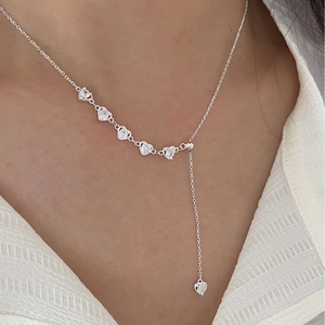 Elegant 925 sterling silver heart necklace with zircon stones worn on neck