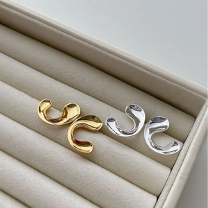 Minimalist C-shape geometric stud earrings in polished gold and silver metal finishes