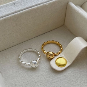 Minimalist glitter draw ball rings in gold and silver finish with polished spherical design
