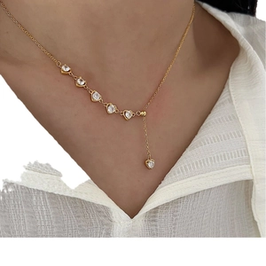 Elegant 925 sterling silver heart necklace with zircon stones worn by a model
