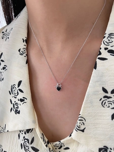 Close-up of S925 silver OT buckle necklace with black heart pendant and mini lock detail