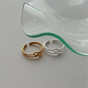 Minimalist double layer wavy rings in gold and silver set with interlocking circles