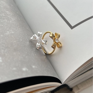Minimalist 925 sterling silver bow ring with dual-tone finish and sparkling zircon