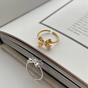 Adjustable 925 sterling silver bow rings in gold and silver finish with twisted rope texture